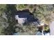 An aerial shot of the house showing the roof and surrounding greenery at 26166 Stillwater Cir, Punta Gorda, FL 33955