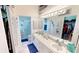 Spacious bathroom with double sinks, walk-in shower, and ample counter space at 26166 Stillwater Cir, Punta Gorda, FL 33955