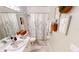 This bathroom features a shower with tub, a toilet, and vanity with sink at 26166 Stillwater Cir, Punta Gorda, FL 33955