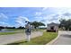 A beautiful entrance to the Seminole Lakes community featuring a water feature and lush landscaping at 26166 Stillwater Cir, Punta Gorda, FL 33955