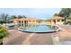 A resort-style community pool with ample seating and covered lounging areas at 26166 Stillwater Cir, Punta Gorda, FL 33955