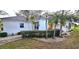 A single-story home with desert landscaping and a bright yellow front door at 26166 Stillwater Cir, Punta Gorda, FL 33955