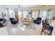 Bright living room with tile floors, plenty of natural light, and comfortable seating at 26166 Stillwater Cir, Punta Gorda, FL 33955