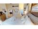 Bright main bedroom with a king-size bed and access to ensuite bathroom at 26166 Stillwater Cir, Punta Gorda, FL 33955