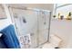 Bathroom features a glass enclosed shower stall and blue and white patterned towels at 26166 Stillwater Cir, Punta Gorda, FL 33955