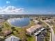 Aerial perspective of a tranquil community nestled beside a serene lake at 26397 Nadir Rd # 208, Punta Gorda, FL 33983
