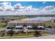 Aerial view of a condo building with lake access and parking at 26397 Nadir Rd # 208, Punta Gorda, FL 33983