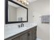 Bathroom with vanity, quartz countertop, and a large mirror at 26397 Nadir Rd # 208, Punta Gorda, FL 33983