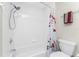 White tiled bathroom with a shower/tub combo at 26397 Nadir Rd # 208, Punta Gorda, FL 33983