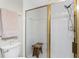 Bathroom with shower, tiled walls, and built-in bench at 26397 Nadir Rd # 208, Punta Gorda, FL 33983
