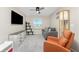 Relaxing bedroom with TV, couch, and chair at 26397 Nadir Rd # 208, Punta Gorda, FL 33983