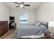 Bedroom with workspace, ceiling fan, and wood-look floors at 26397 Nadir Rd # 208, Punta Gorda, FL 33983