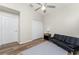 Bedroom with double closet and wood-look floors at 26397 Nadir Rd # 208, Punta Gorda, FL 33983