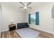 Bedroom with sofa bed, ceiling fan, and wood-look floors at 26397 Nadir Rd # 208, Punta Gorda, FL 33983