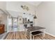 Condo dining area with table and bench seating, adjacent to kitchen at 26397 Nadir Rd # 208, Punta Gorda, FL 33983