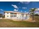 Condo building with pool and surrounding landscape at 26397 Nadir Rd # 208, Punta Gorda, FL 33983