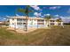 Condo building with pool and lush green lawn at 26397 Nadir Rd # 208, Punta Gorda, FL 33983