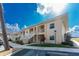 Exterior view of condo building showcasing its architectural details and landscaping at 26397 Nadir Rd # 208, Punta Gorda, FL 33983