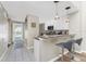 Condo kitchen with breakfast bar, modern cabinetry and pendant lighting at 26397 Nadir Rd # 208, Punta Gorda, FL 33983