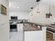 Modern kitchen with stainless steel appliances and granite countertops at 26397 Nadir Rd # 208, Punta Gorda, FL 33983