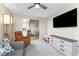 Living room with comfortable seating and a view to kitchen at 26397 Nadir Rd # 208, Punta Gorda, FL 33983