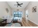 Bright living room with lake view, comfy couch, and wood floors at 26397 Nadir Rd # 208, Punta Gorda, FL 33983