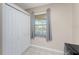 Bright pantry with white cabinets and a window at 26397 Nadir Rd # 208, Punta Gorda, FL 33983