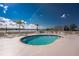 Relaxing community pool area with lake view at 26397 Nadir Rd # 208, Punta Gorda, FL 33983
