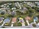 Aerial view of a house in a residential neighborhood with surrounding houses visible at 26572 Trinilas Dr, Punta Gorda, FL 33983