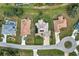 Aerial view of a residential neighborhood, showcasing a home with solar panels at 26572 Trinilas Dr, Punta Gorda, FL 33983