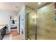 Bathroom with walk-in shower and view of bedroom at 26572 Trinilas Dr, Punta Gorda, FL 33983