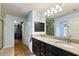 Double vanity bathroom with granite countertop and walk-in shower at 26572 Trinilas Dr, Punta Gorda, FL 33983