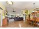 Bright dining room with hardwood floors and wooden dining set at 26572 Trinilas Dr, Punta Gorda, FL 33983