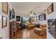 Gathering room with two sofas, a ceiling fan, and wood flooring at 26572 Trinilas Dr, Punta Gorda, FL 33983