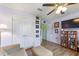 Gathering room with a sofa, ceiling fan, and wood flooring at 26572 Trinilas Dr, Punta Gorda, FL 33983