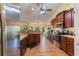 Well-equipped kitchen with stainless steel appliances and granite counters at 26572 Trinilas Dr, Punta Gorda, FL 33983