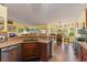 Spacious kitchen with island, stainless steel appliances, and breakfast nook at 26572 Trinilas Dr, Punta Gorda, FL 33983