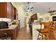 Modern kitchen with stainless steel appliances and wood cabinets at 26572 Trinilas Dr, Punta Gorda, FL 33983