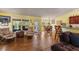 Open concept living area with access to the kitchen and backyard at 26572 Trinilas Dr, Punta Gorda, FL 33983