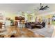 Open concept living space with kitchen island and seating area at 26572 Trinilas Dr, Punta Gorda, FL 33983