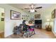 Home office with desk, chair, and artwork on the walls at 26572 Trinilas Dr, Punta Gorda, FL 33983