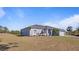 Gray house with a gray roof, white columns, and a two-car garage at 2668 Clovelon St, North Port, FL 34291