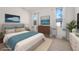 Cozy bedroom showcasing a plush bed, decorative pillows, and natural light from the large windows at 27066 Sumatra Dr, Punta Gorda, FL 33955