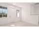 Light and airy entryway with white door and vinyl flooring at 27066 Sumatra Dr, Punta Gorda, FL 33955