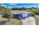 House exterior with driveway and landscaping at 27131 Ann Arbor Ave, Punta Gorda, FL 33983