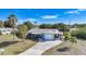 Aerial view of the house, yard, and neighborhood at 27131 Ann Arbor Ave, Punta Gorda, FL 33983