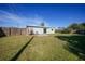 Sunny backyard with patio and green space at 27131 Ann Arbor Ave, Punta Gorda, FL 33983