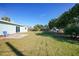 Landscaped backyard with patio and shed at 27131 Ann Arbor Ave, Punta Gorda, FL 33983