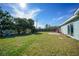 Large backyard with grassy area and patio at 27131 Ann Arbor Ave, Punta Gorda, FL 33983