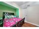 Well-lit bedroom with a full-size bed and ample closet space at 27131 Ann Arbor Ave, Punta Gorda, FL 33983